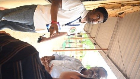A presenter in conversation with parents